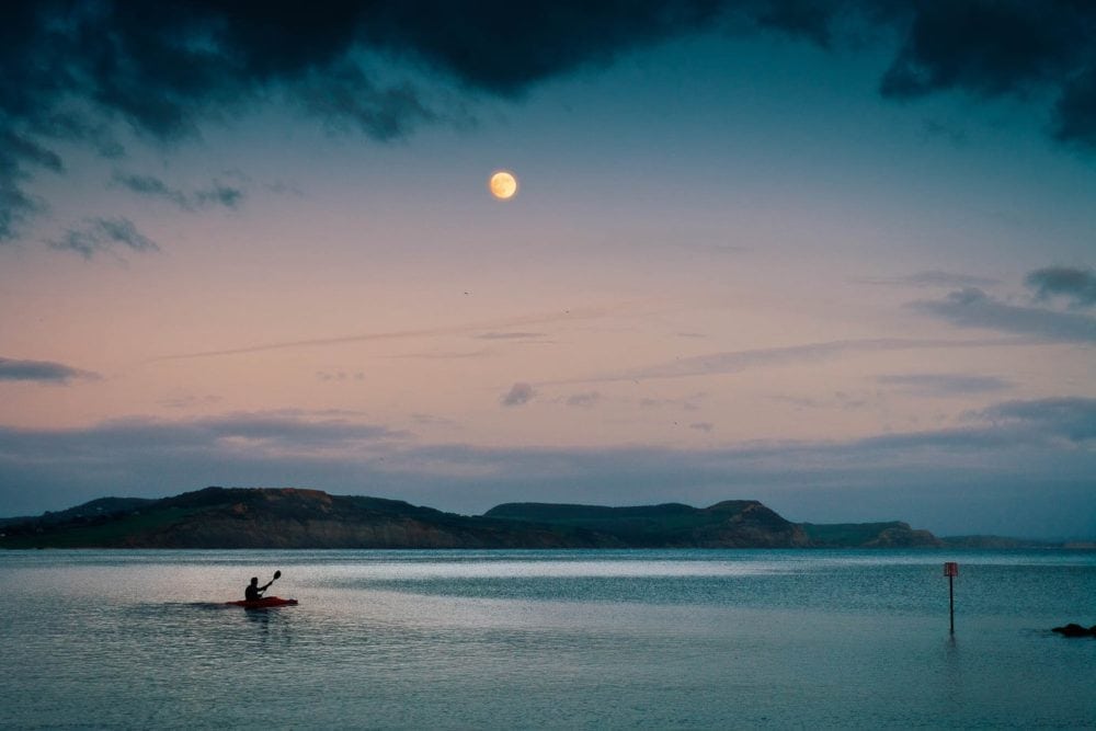 Tourism-photography-kayak-moonrise-lyme-bay